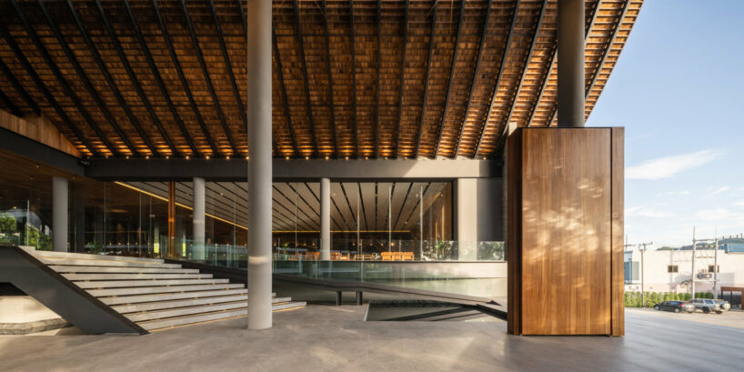 roof ridges dramatically collide atop the new keeree tara riverside in thailand