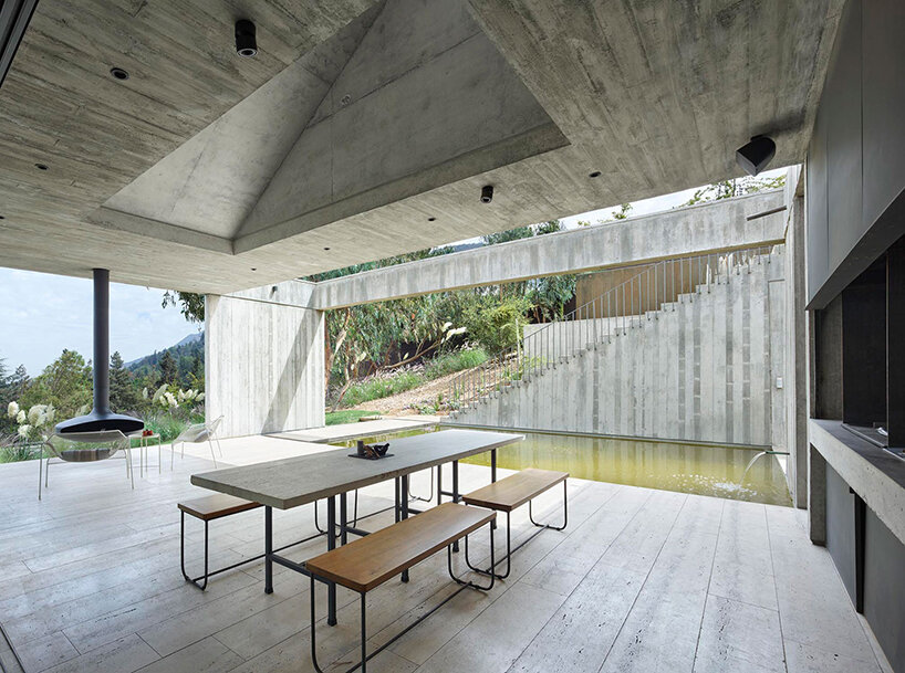 centered around a patio, this house in chile subtly meshes exposed concrete with travertine