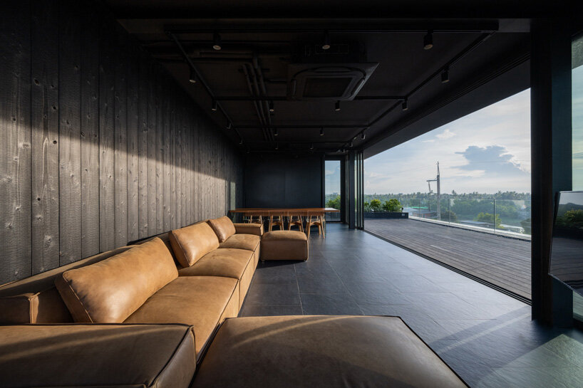 V2in architects stacks cantilevering volumes woven with greenery for home office in thailand