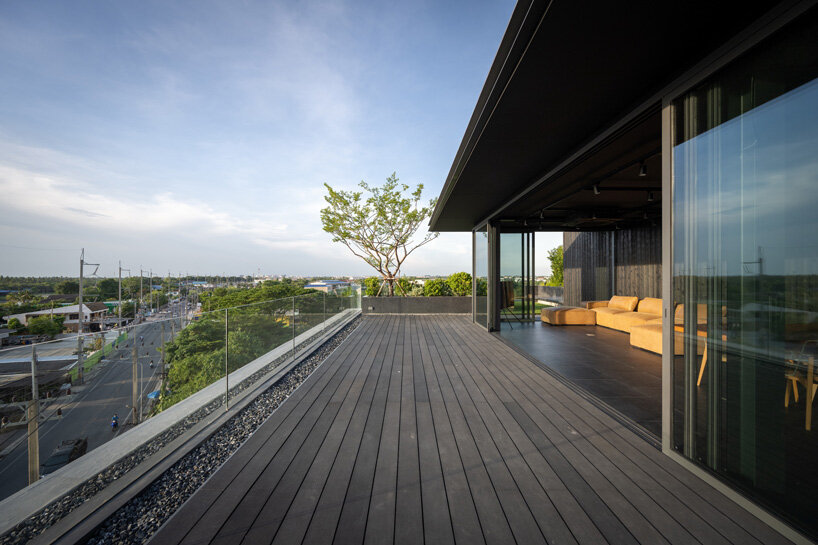 V2in architects stacks cantilevering volumes woven with greenery for home office in thailand