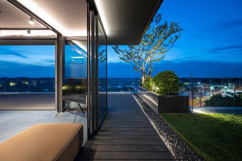 V2in architects stacks cantilevering volumes woven with greenery for home office in thailand