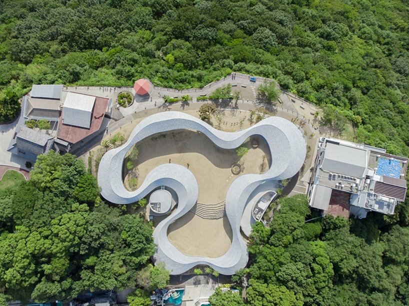 elevated walkway by takashi suo meanders through national park in japan