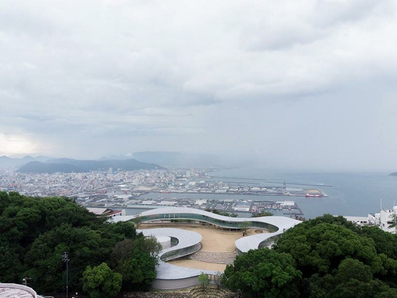 elevated walkway by takashi suo meanders through national park in japan