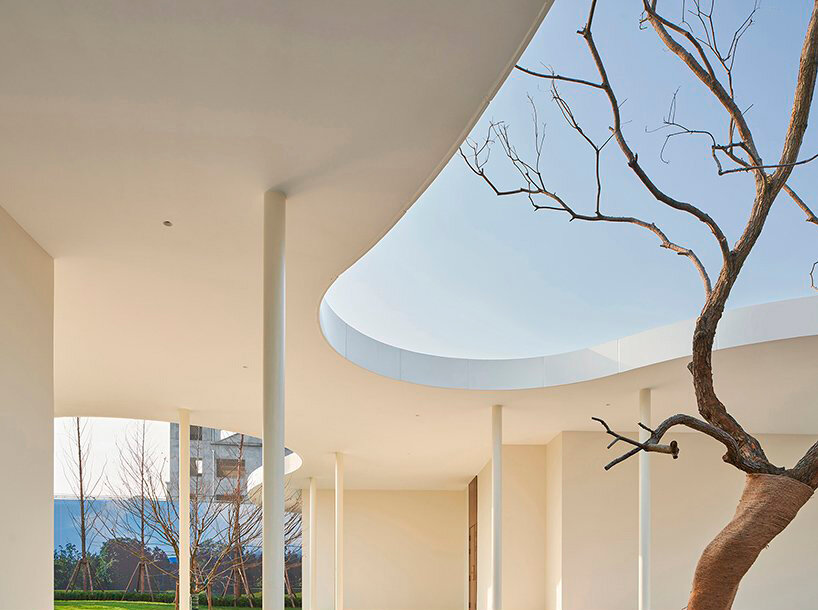 white orchid pavilion in china unravels exhibition booth in curved abstract forms