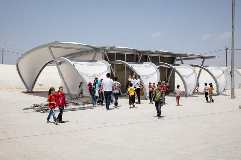 zaha hadid designs 27 tents as schools, clinics and shelters for refugee communities
