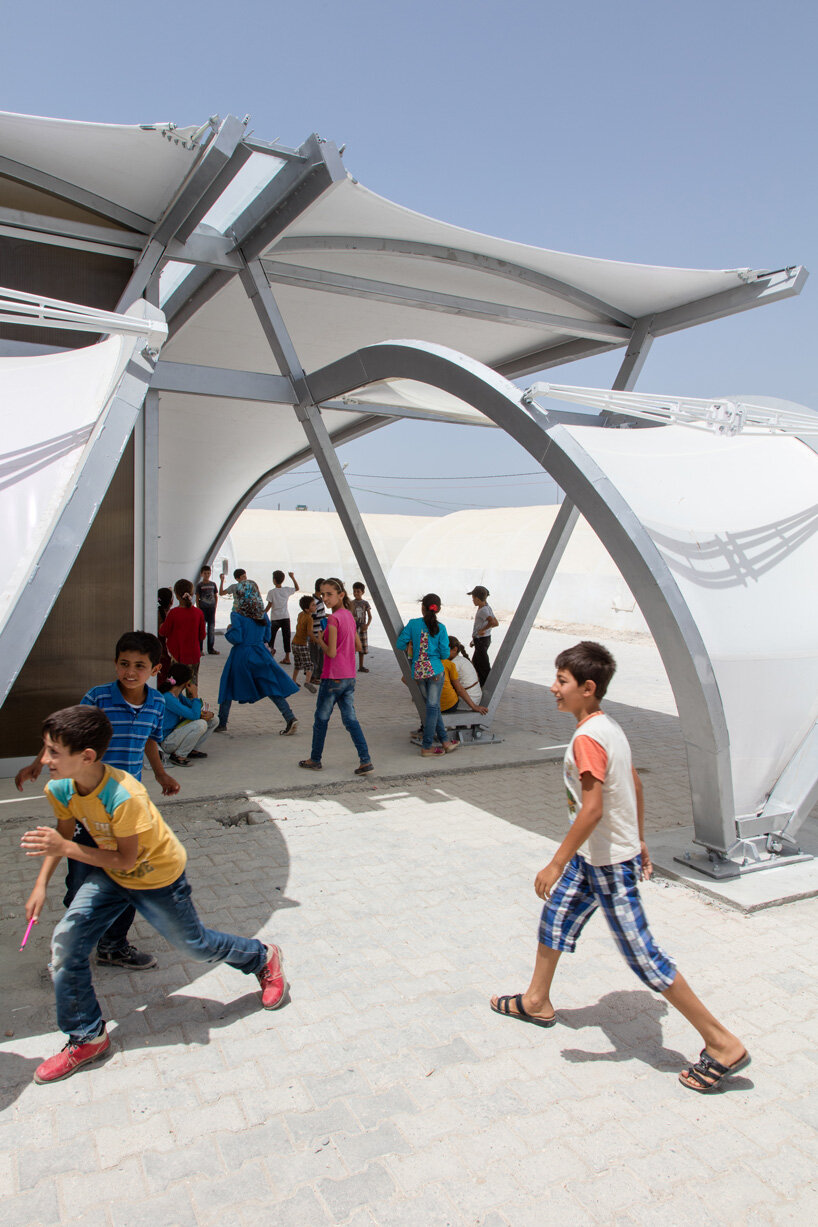 zaha hadid designs 27 tents as schools, clinics and shelters for refugee communities