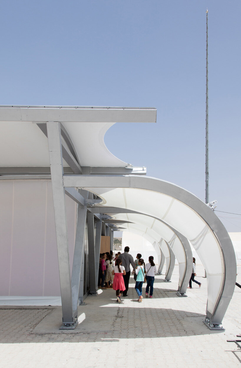 zaha hadid designs 27 tents as schools, clinics and shelters for refugee communities