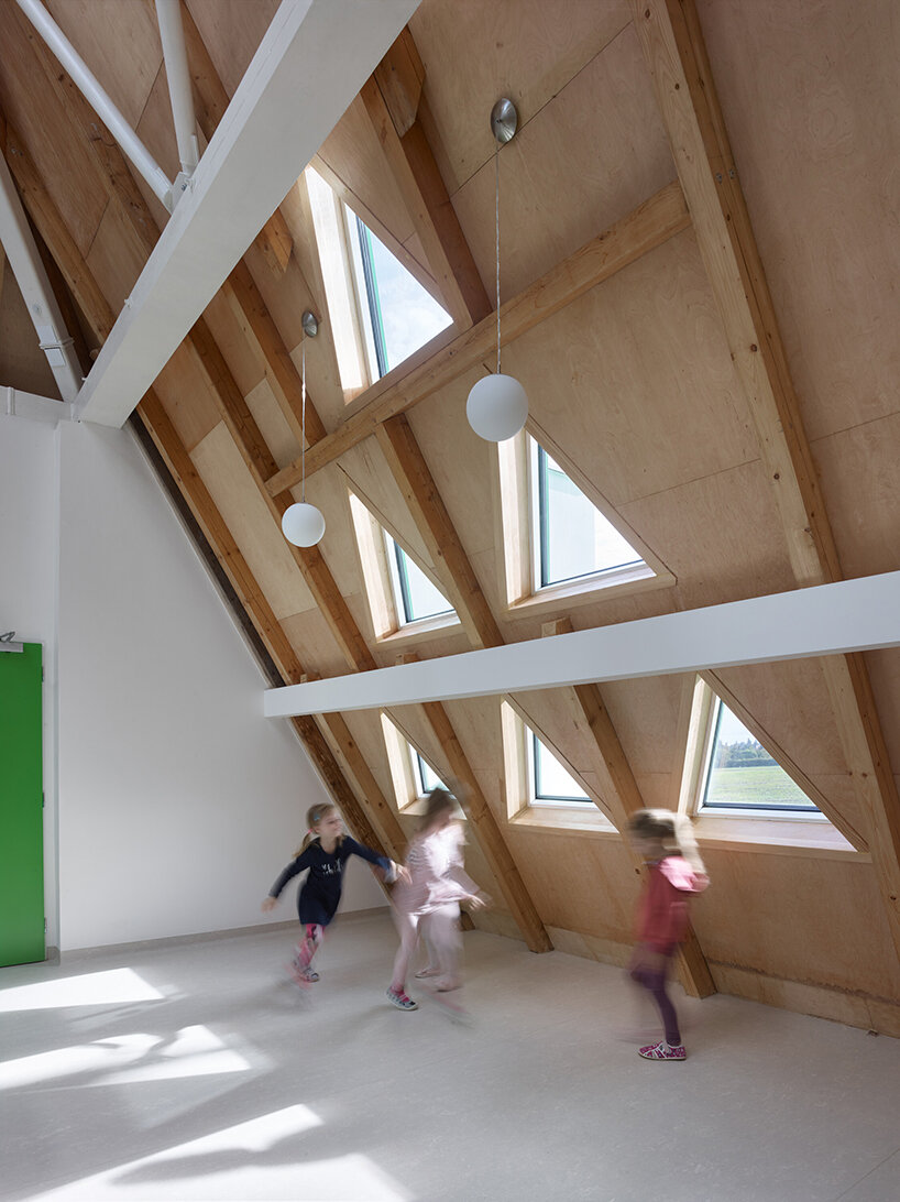 protruding, colored 'sheds' envelop architektura's kindergarten design in czechia