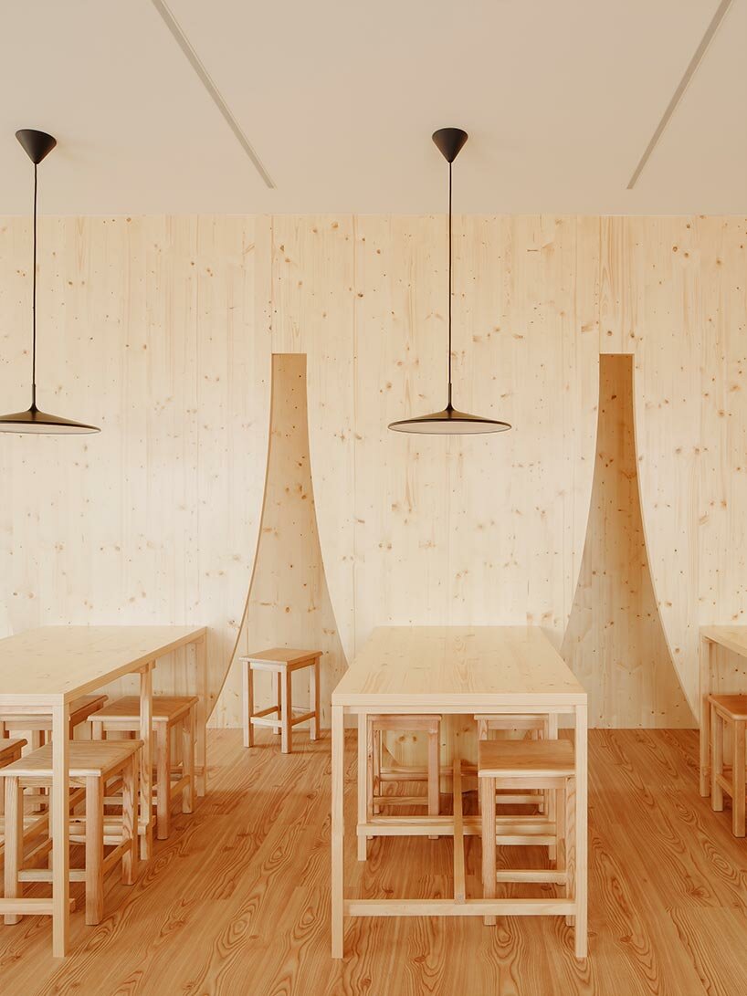 funnel-shaped cutouts finish snug restaurant in portugal