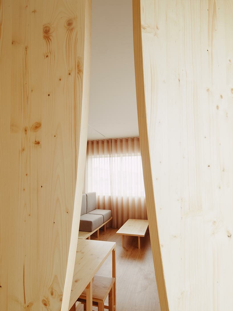 funnel-shaped cutouts finish snug restaurant in portugal