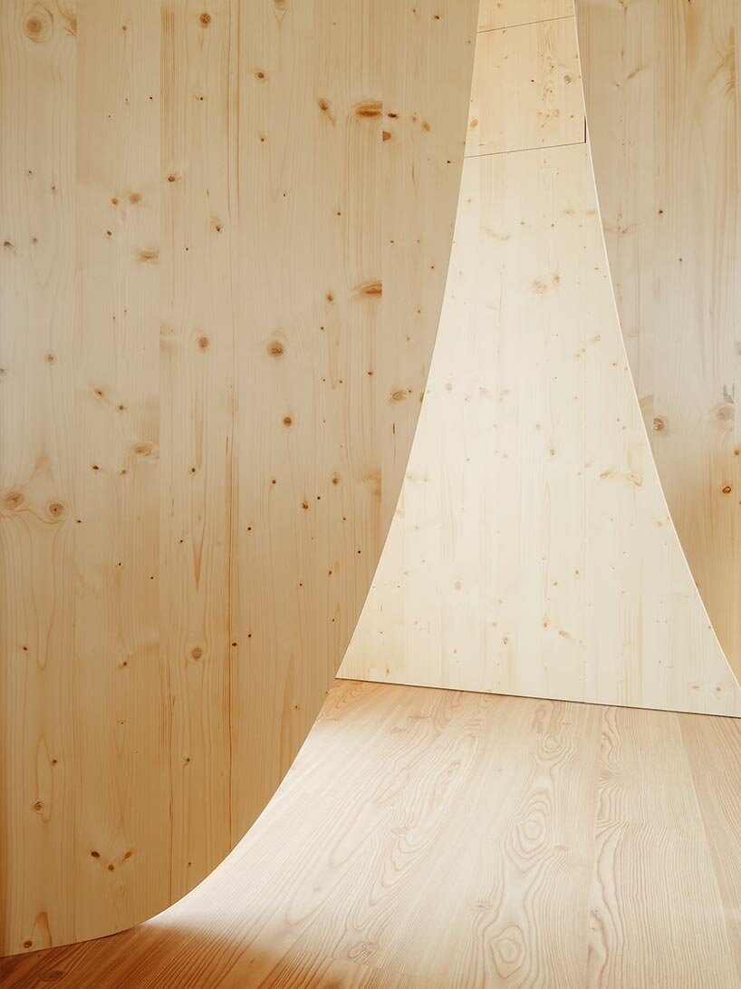 funnel-shaped cutouts finish snug restaurant in portugal