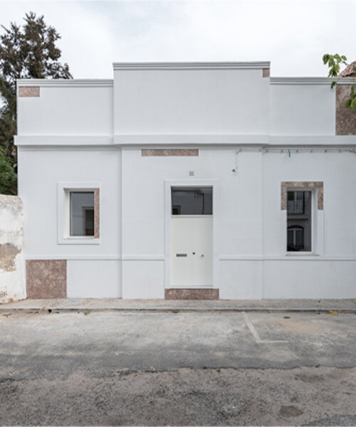 corpo atelier scatters pink limestone across a portuguese villa's traditional, all-white exterior