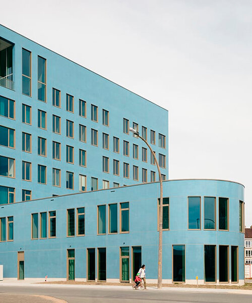 blue glass mosaic overlays maritime scientific research building in belgium