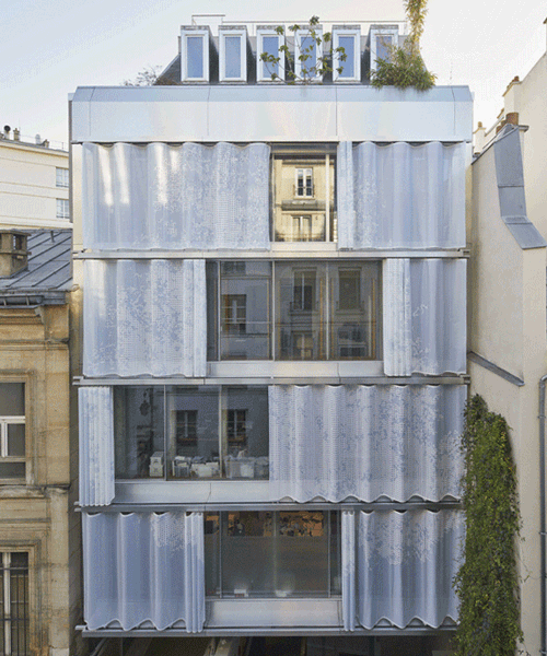 inside outside shrouds new parisian building with a perforated textile façade