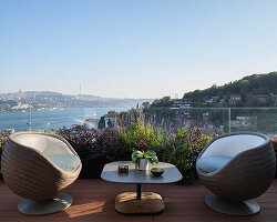 reflective sculptural staircase interposes in renovated roof apartment in istanbul