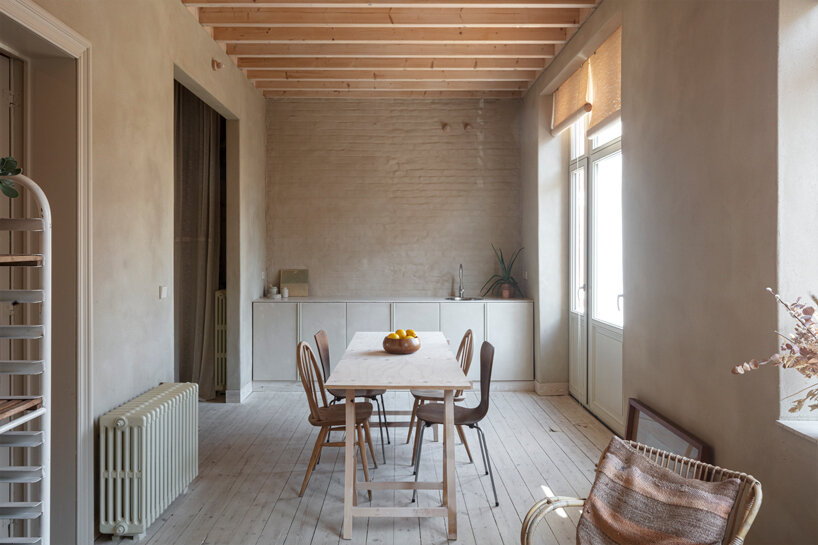 hé! transforms industrial building into house with timber roof extension in brussels