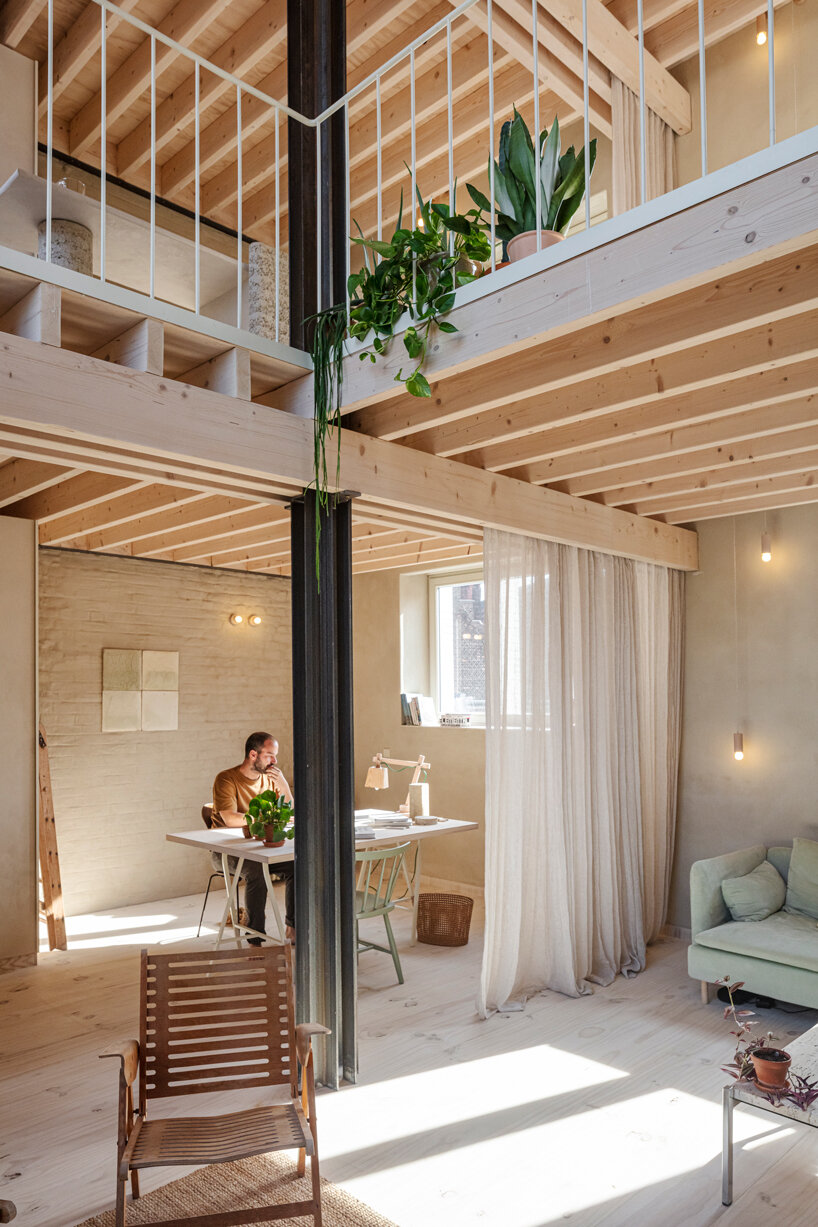 hé! transforms industrial building into karper house with timber roof extension in brussels