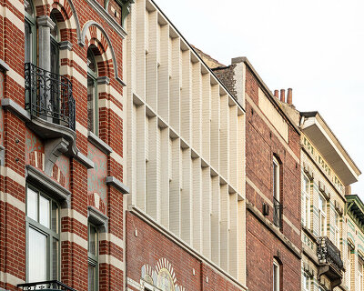 hé! transforms industrial building into house with timber roof extension in brussels