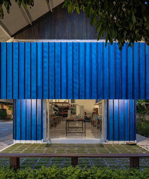 sher maker tops pleated wood longhouse with steel roof for fashion studio in chiang mai
