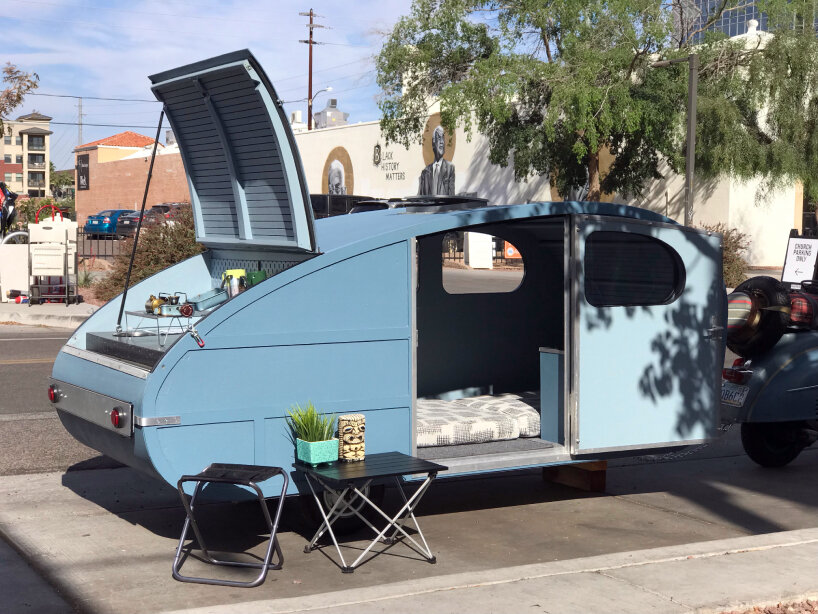 foam-made micro teardrop trailer for vintage vespa hides portable kitchen  in trunk