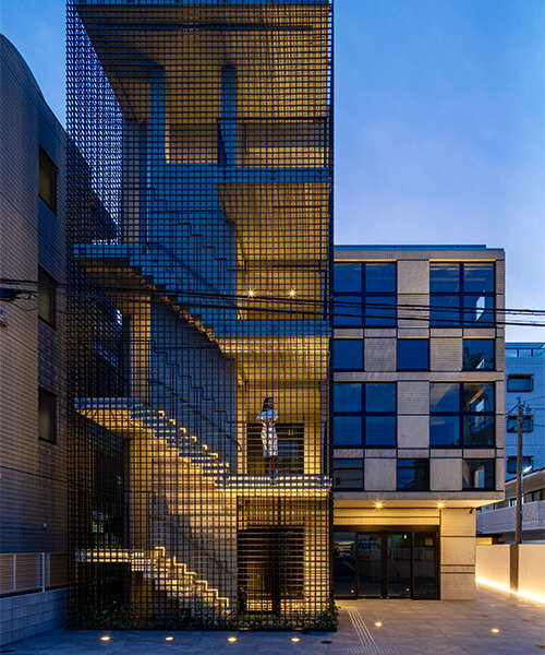 mosquito net-like latticework envelops SAKO's concrete multi-tenant building in japan