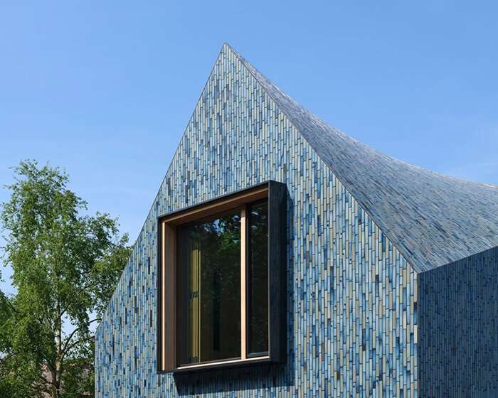multicolored glazed tile cladding enchants mecanoo's villa bw with iridescent effect