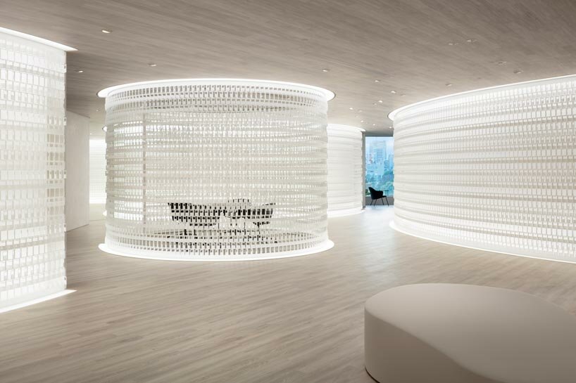 nendo engraves intricate patterns of pokémon cards into new office's organic arrangement
