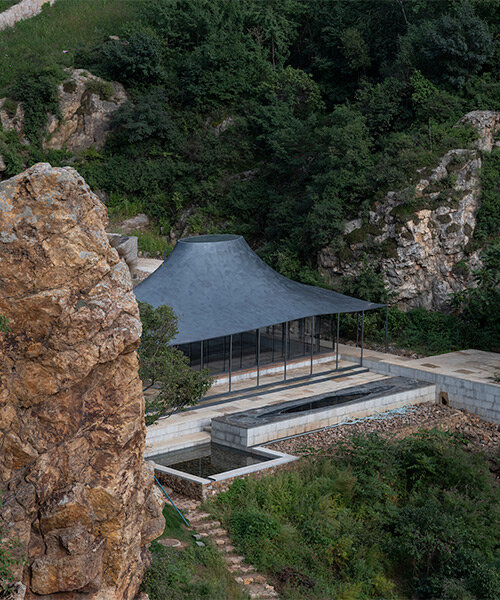 sculptural carbon fiber roof funnels light into atelier deshaus' meditation hall in china