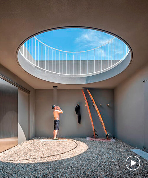 circular skylight pierces surfers' weekend house on south korean seafront