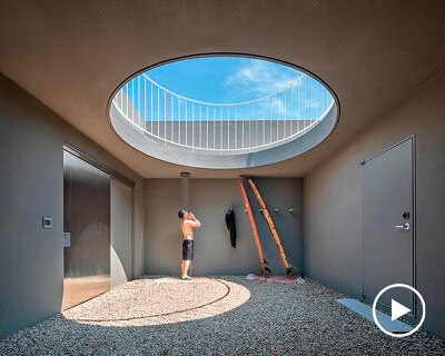 circular skylight pierces surfers' weekend house on south korean seafront