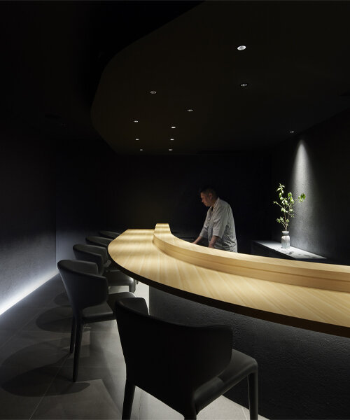 black-ink walls and dimmed lighting engulf this members-only sushi restaurant in tokyo