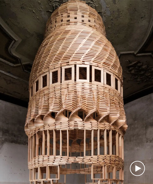 raffaele salvoldi shapes towering installations using 'thousands of planks, locked by gravity'