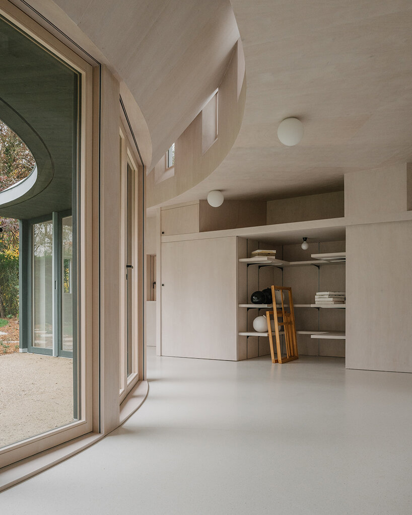 cabinet's snug and curving artist studio in geneva unfolds like a garden gallery