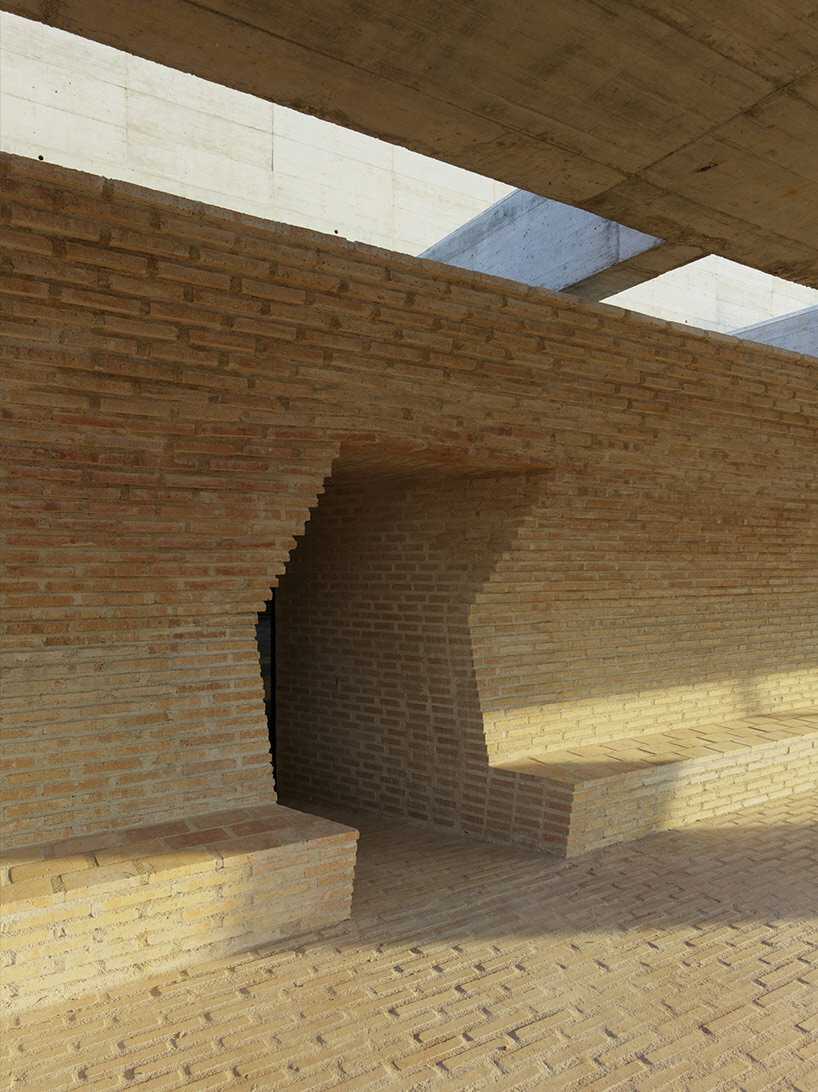 A chapel-like brick building encloses the BAAS arquitectura health center in Barcelona