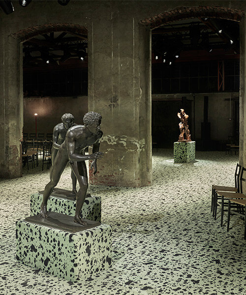 bottega veneta FW23 show unfolds among futurist boccioni statue & ancient roman bronzes