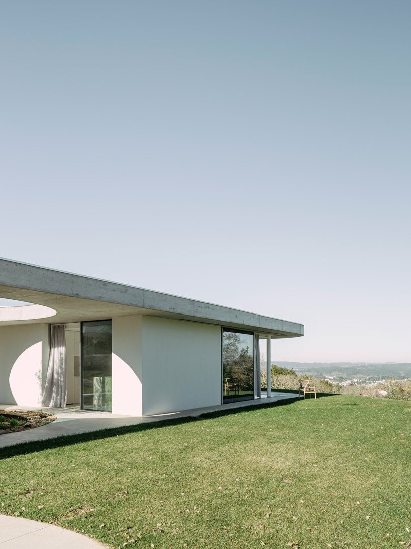 concrete geometries embrace bruno dias' casa chouso in portugal