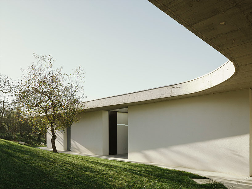 concrete geometries embrace bruno dias' casa chouso in portugal