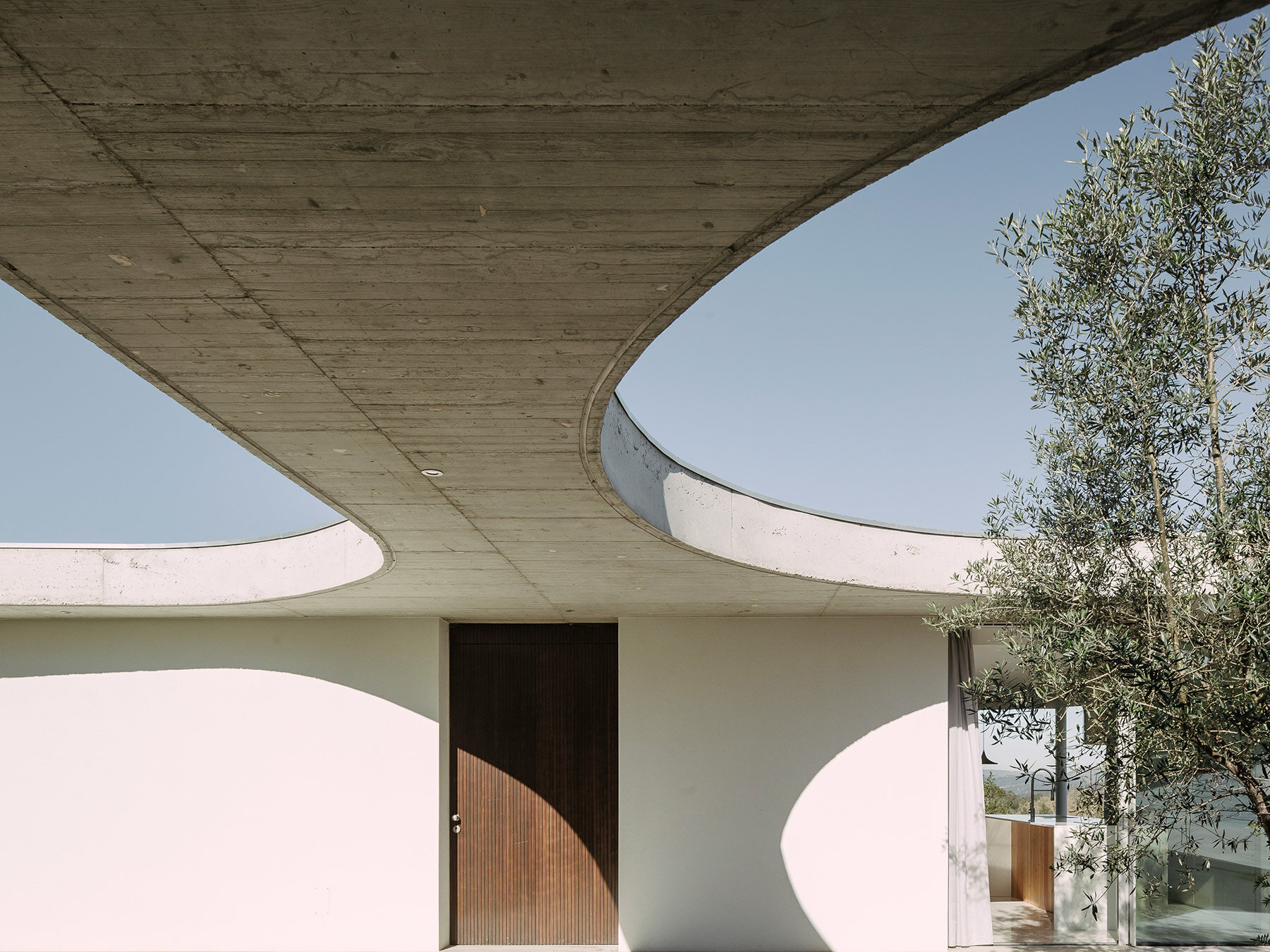 concrete geometries embrace bruno dias' casa chouso in portugal