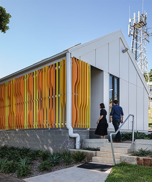 colorful timber screen with hidden morse code message decorates art gallery in australia