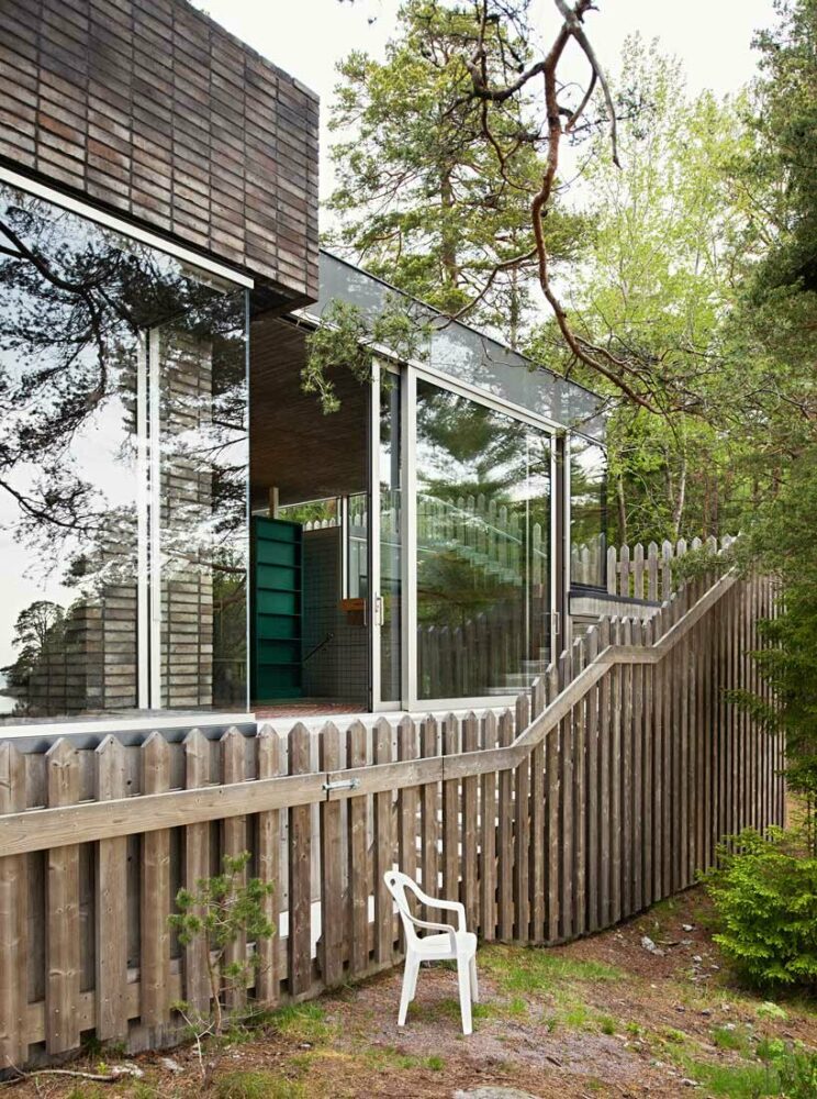 wooden hedge facade enfolds villa on the coastline of stockholm