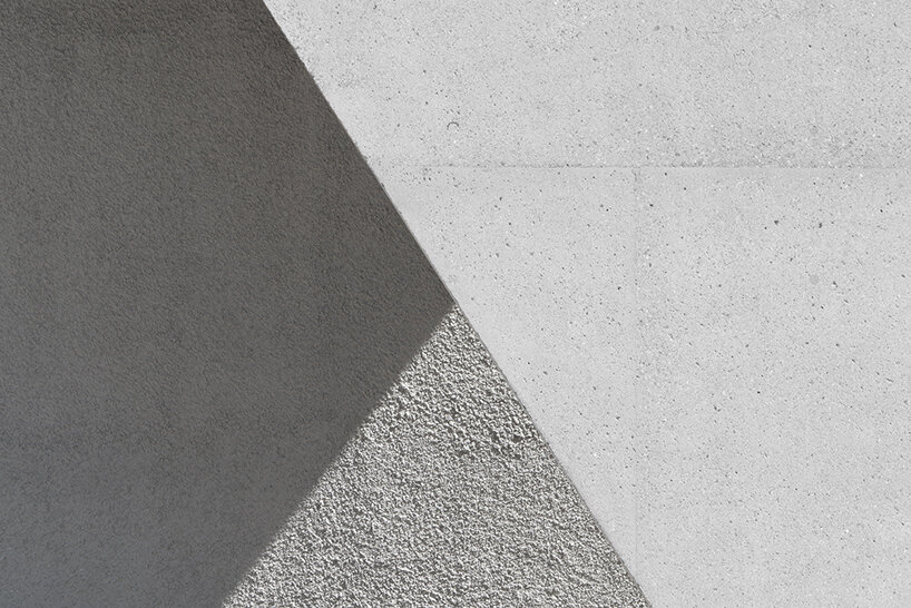 modusarchitects' long concrete sports center divides italian mountain