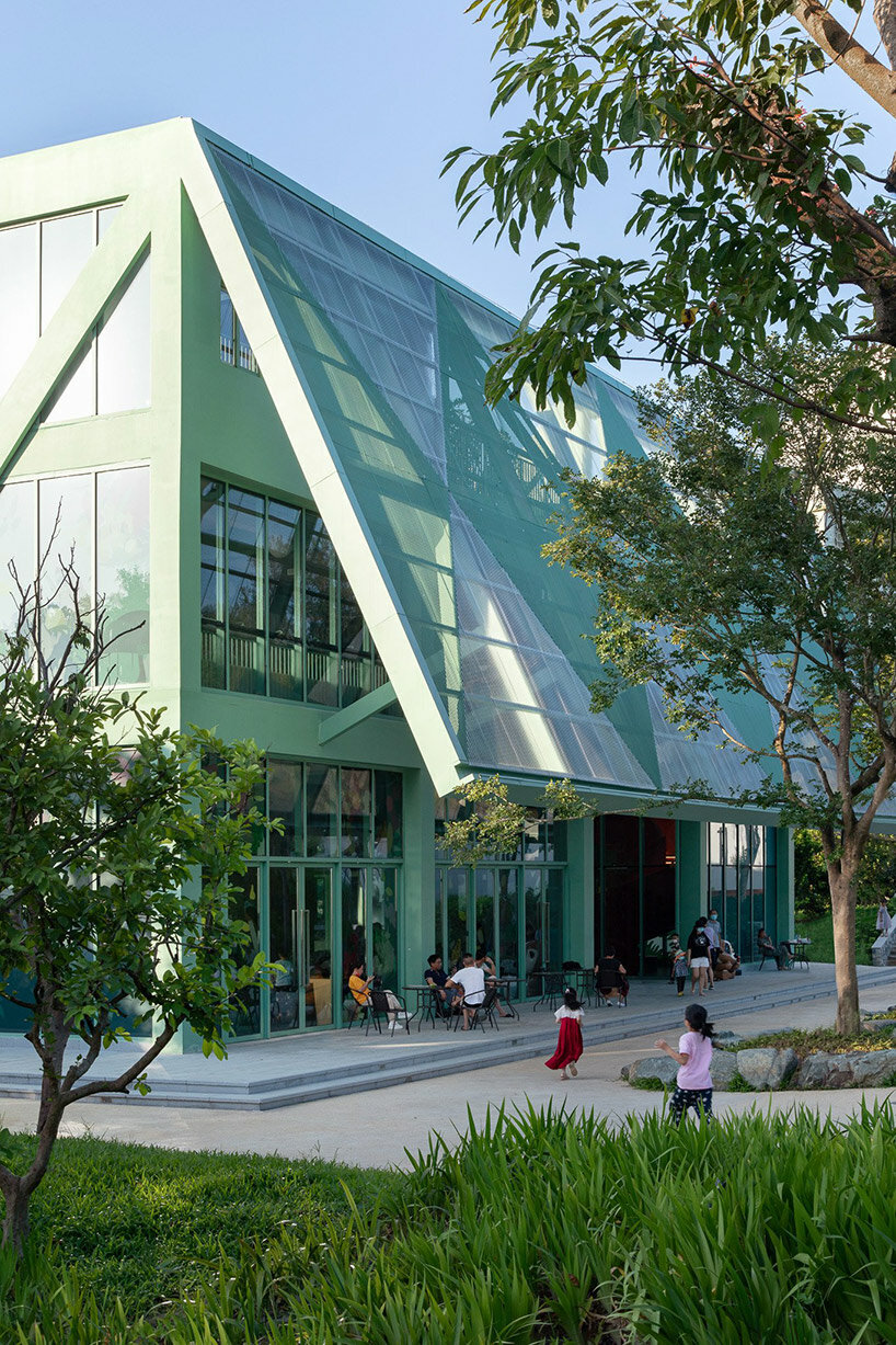 vivid breathable pavilion is nestled within lush children's park in shenzhen, china