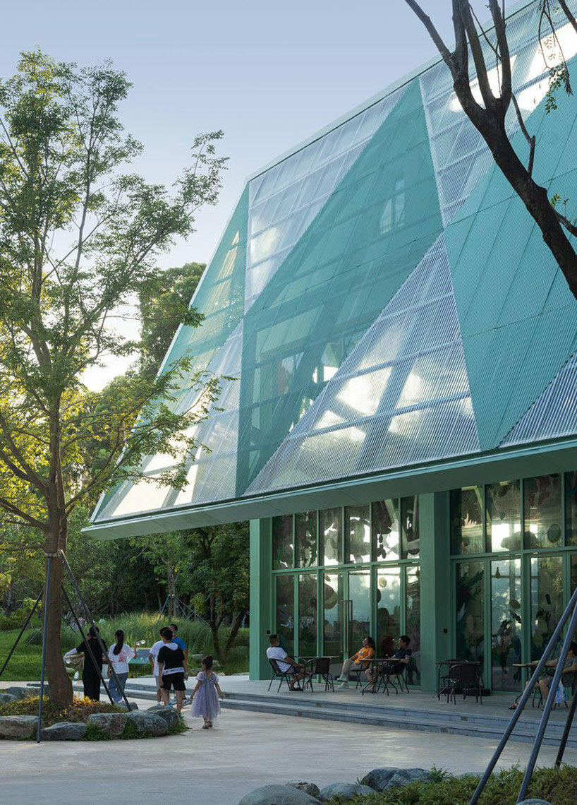 vivid breathable pavilion nestles within lush children's park in shenzhen, china