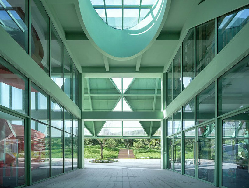 vivid breathable pavilion is nestled within lush children's park in shenzhen, china