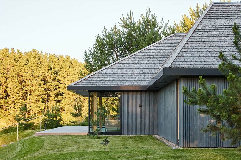 in the picturesque hills of lithuania, a cluster of guest houses by HEIMA gazes skywards