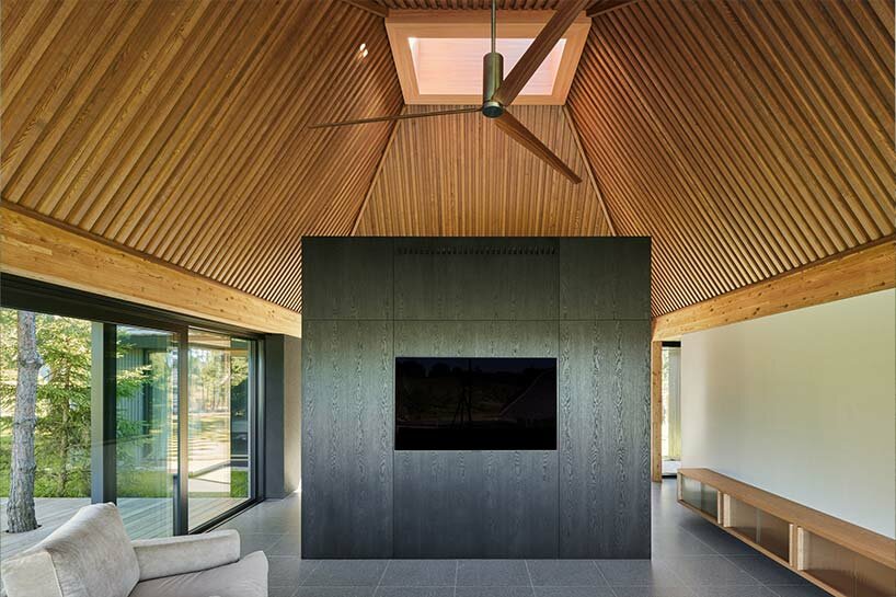 in the picturesque hills of lithuania, a cluster of guest houses by HEIMA gazes skywards