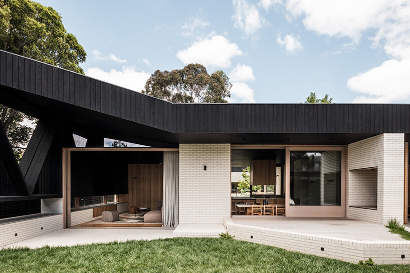 figr architecture studio’s charred timber shell shelters home in australia