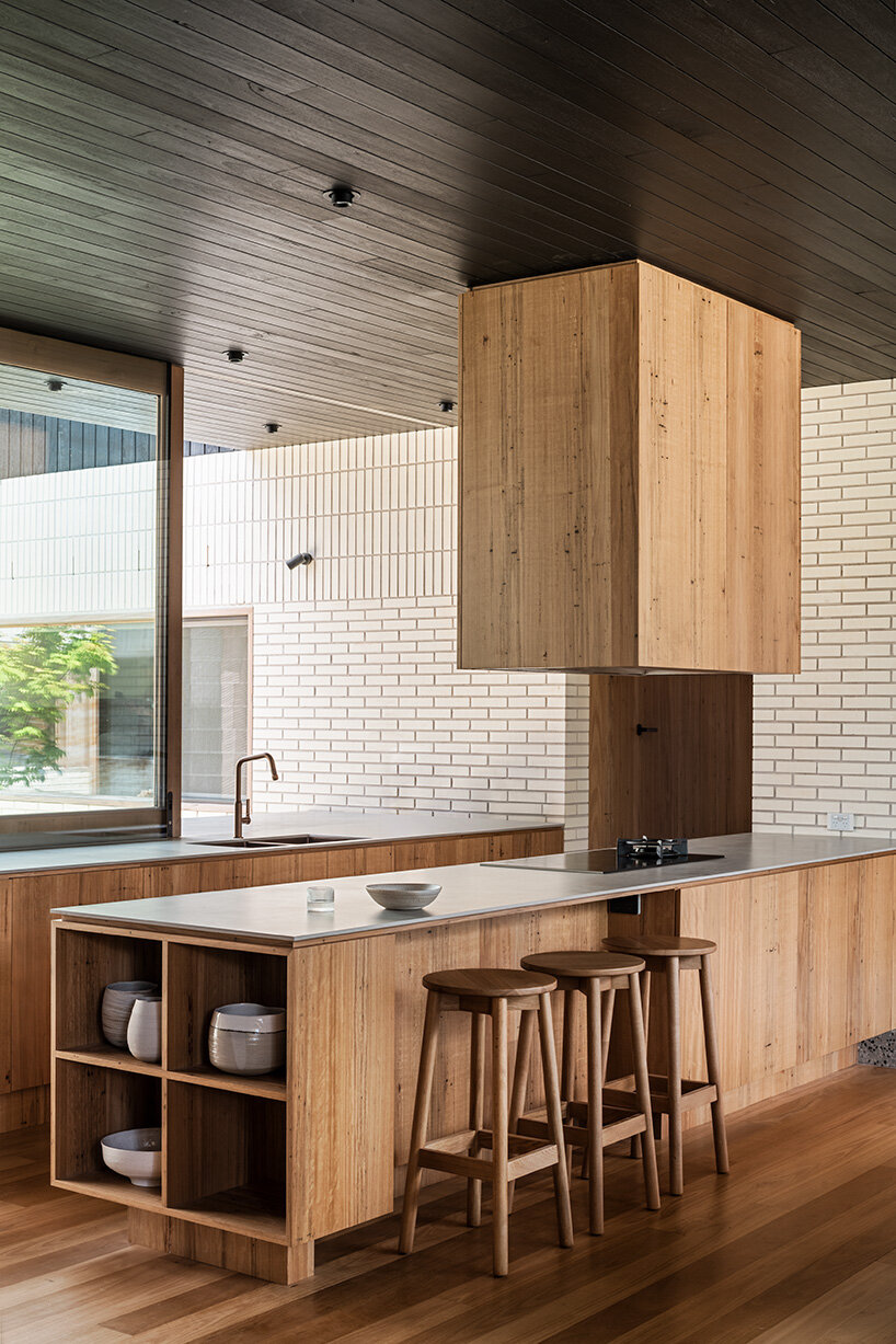 figr architecture studio’s charred timber shell shelters home in australia