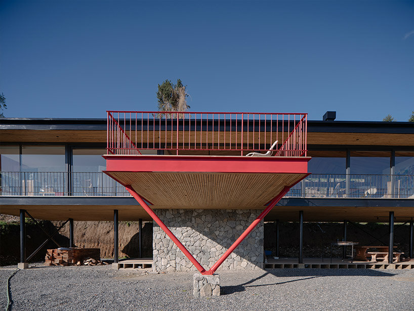 elongated 'la empastada house' frames sweeping vistas of rural chile