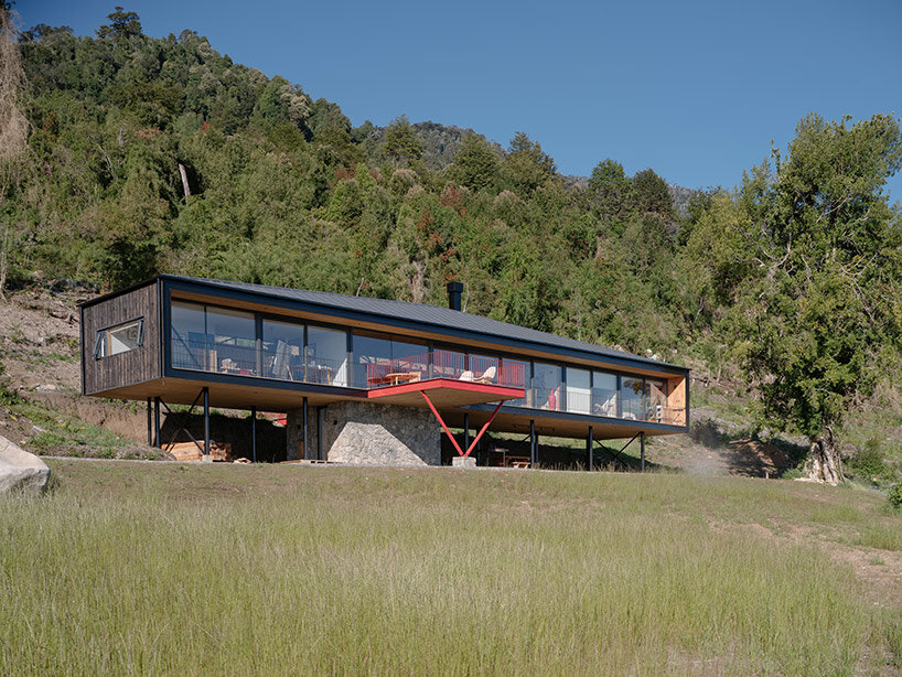 elongated 'la empastada house' frames sweeping vistas of rural chile